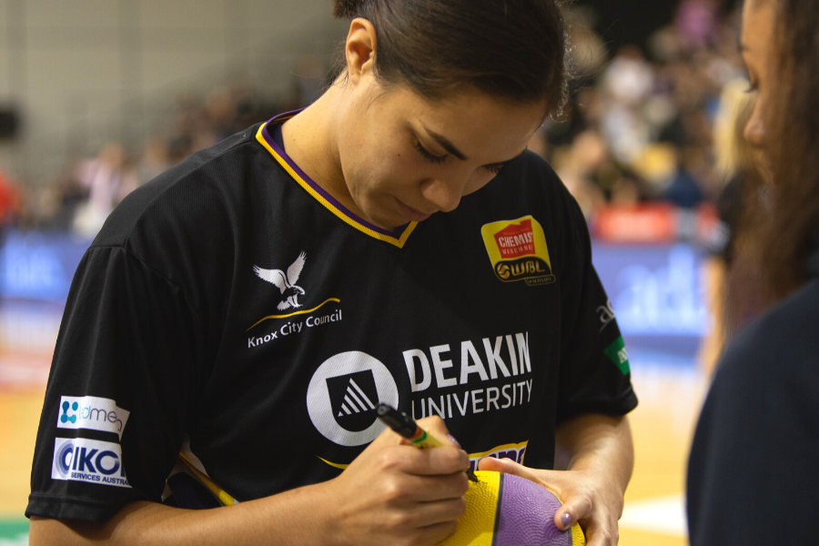 Kalani signing fan's basketball